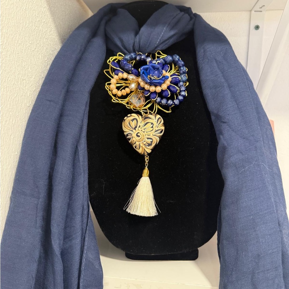 Elegant Blue and Gold Brooch with Tassel
